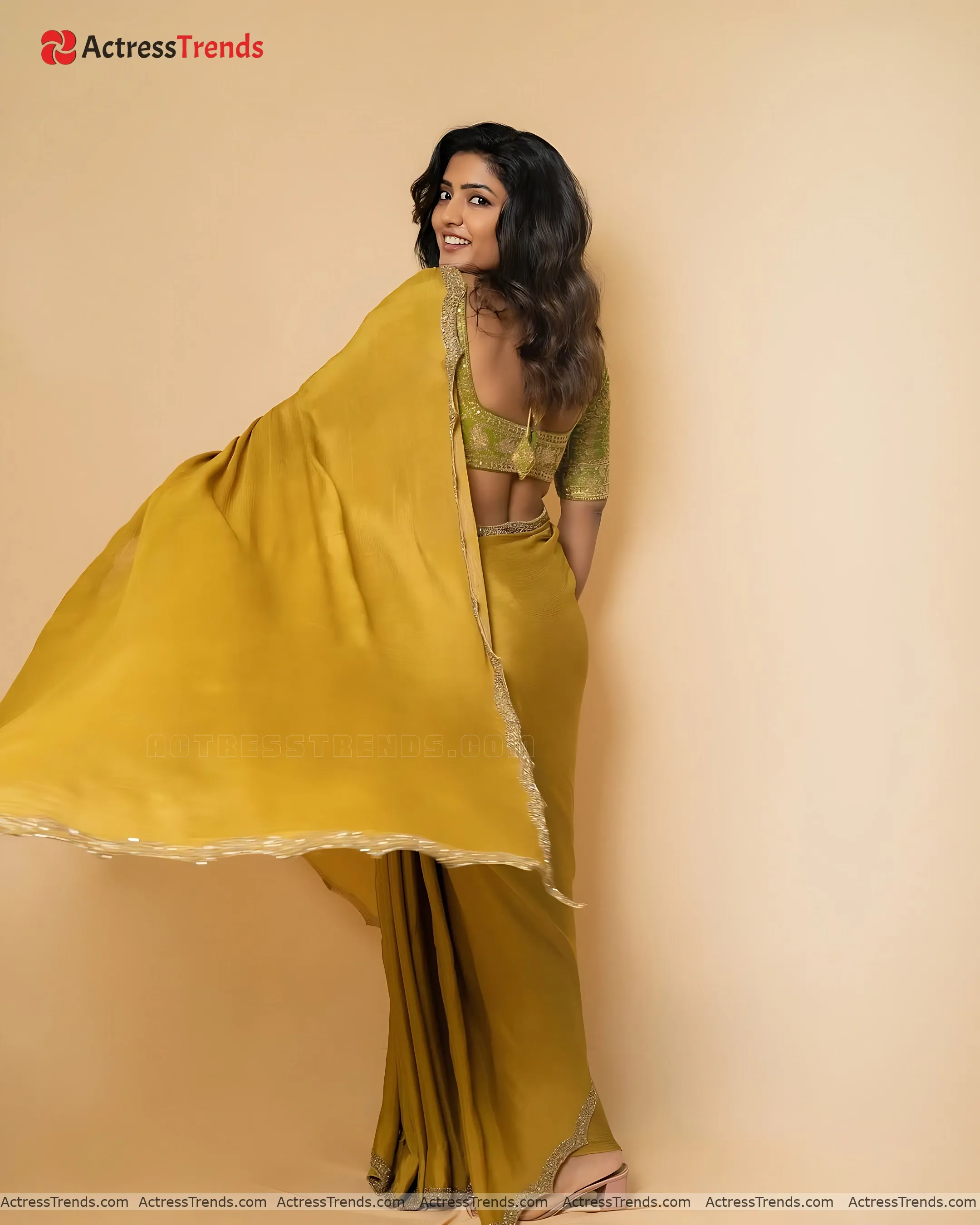 Eesha Rebba Gold Saree Bold Style Back Pose